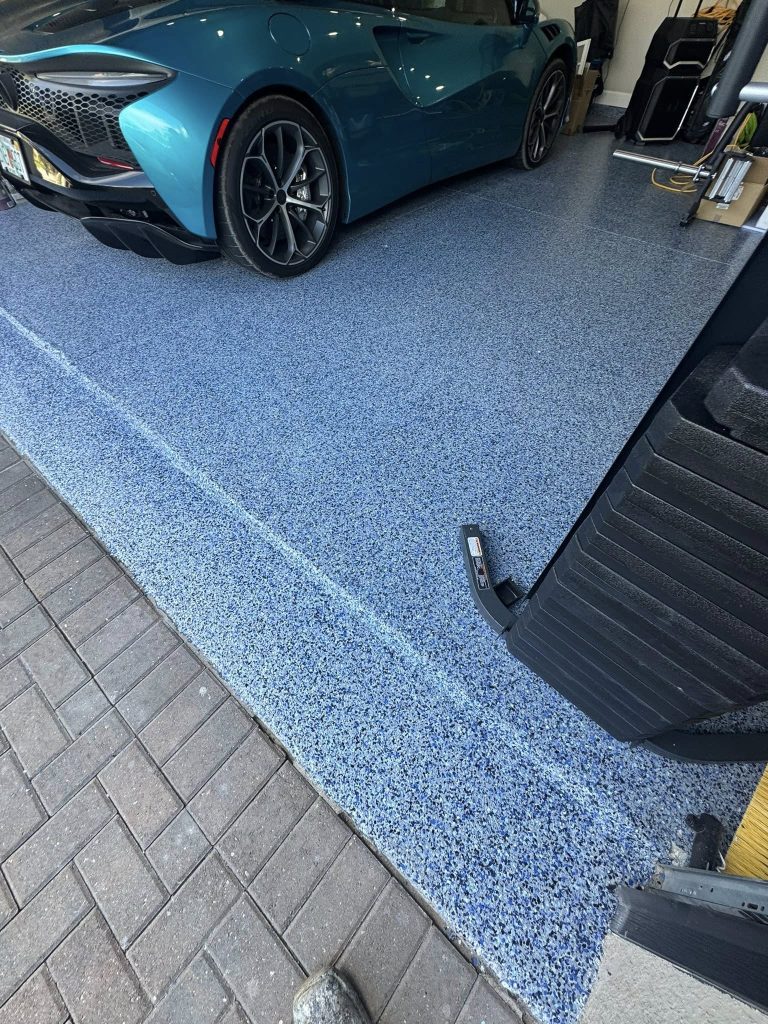 Blue flake garage floor built for hot tires