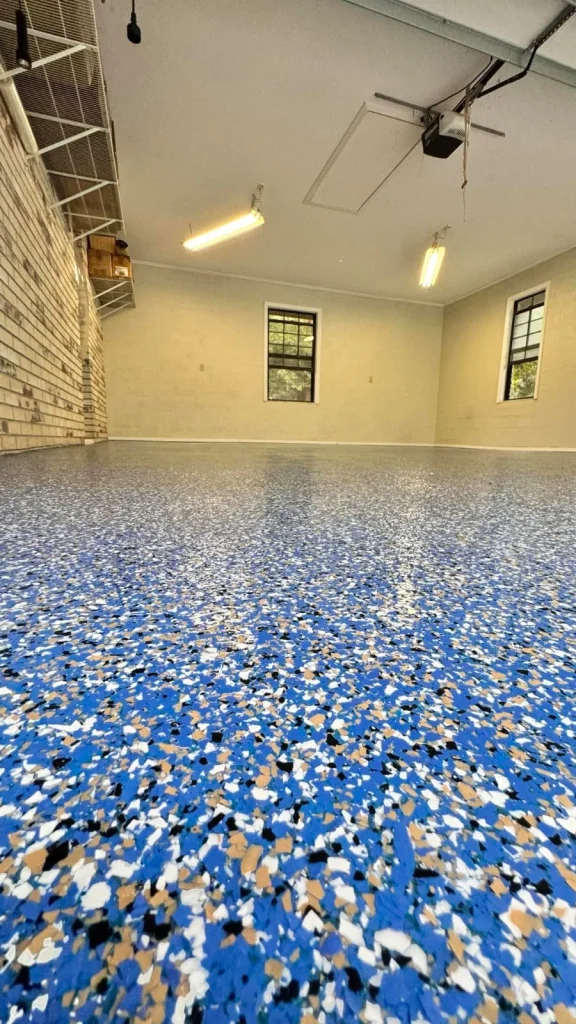 Blue flake epoxy garage floor in a Parrish-area home
