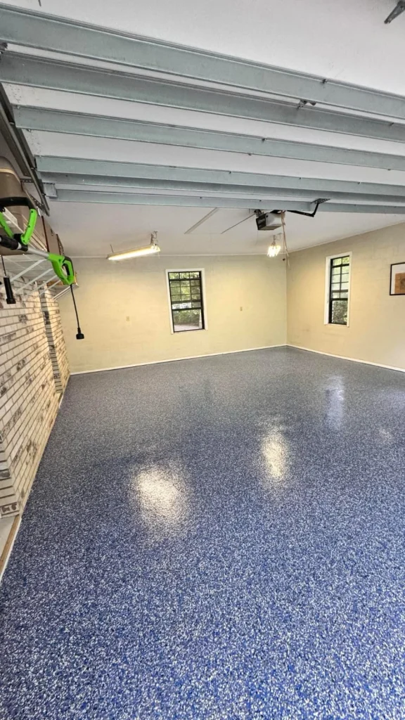 Gray flake epoxy garage floor in a Riverview-area home