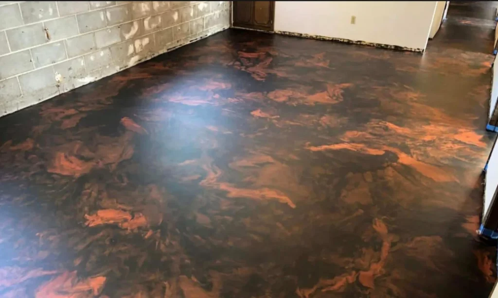 Metallic epoxy floor with marbled bronze and orange finish