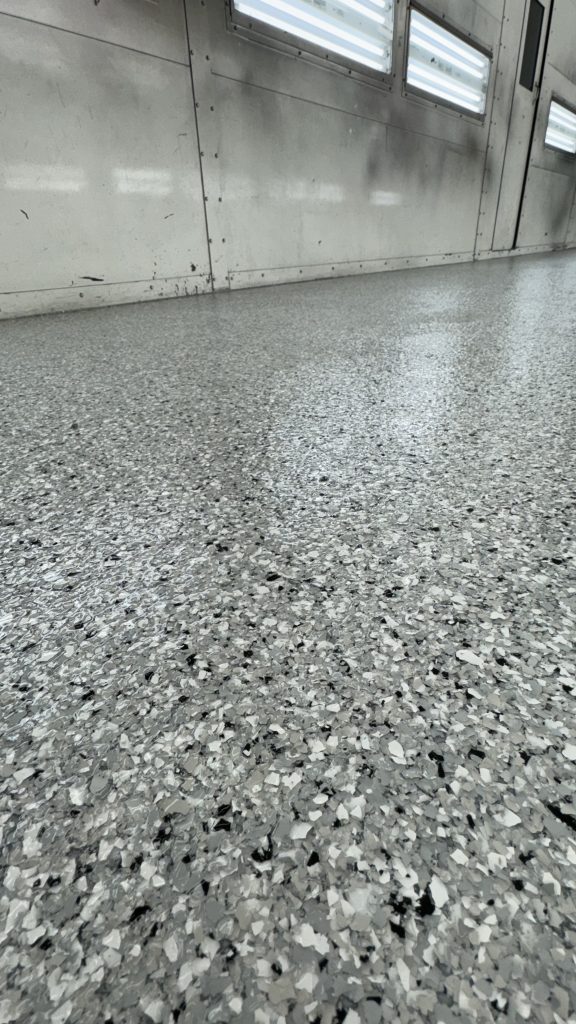 Close-up of a full-broadcast flake epoxy coating