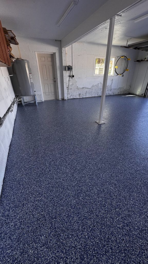 Blue flake epoxy and polyaspartic garage floor coating