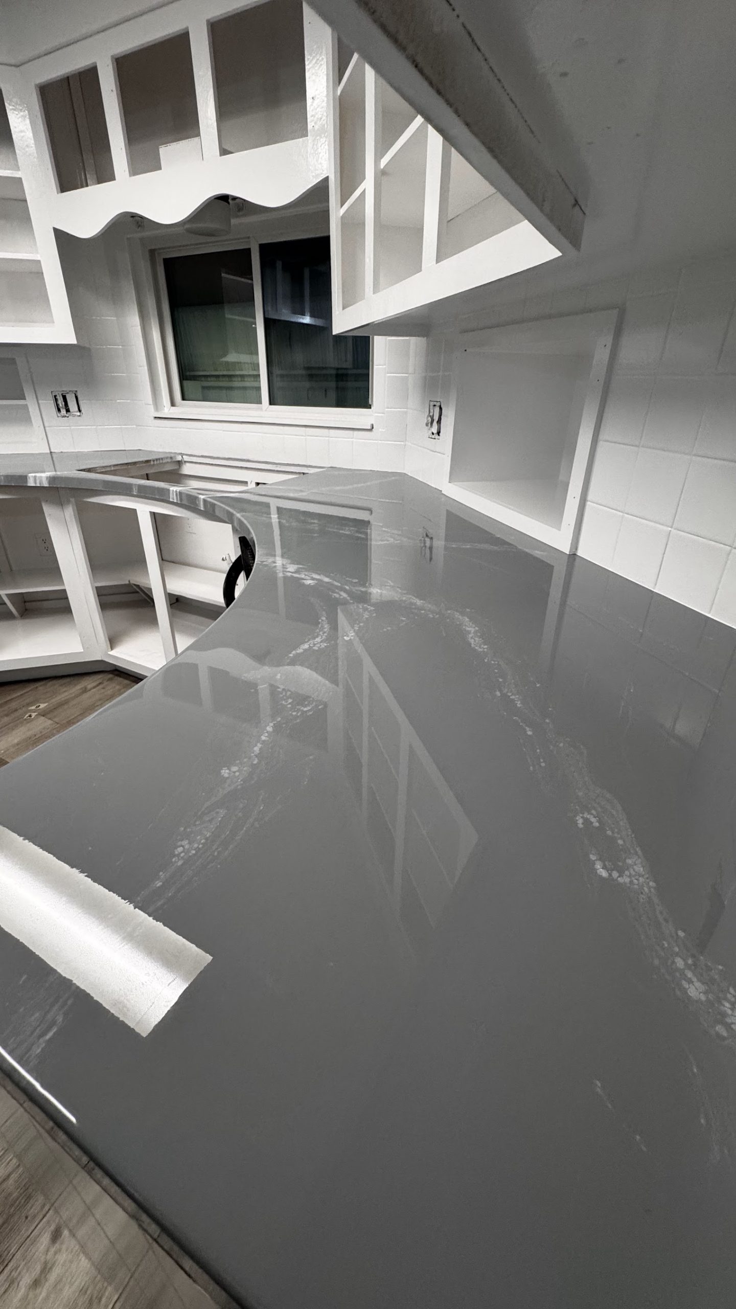 Close-up of gray marbled epoxy countertop finish on kitchen island