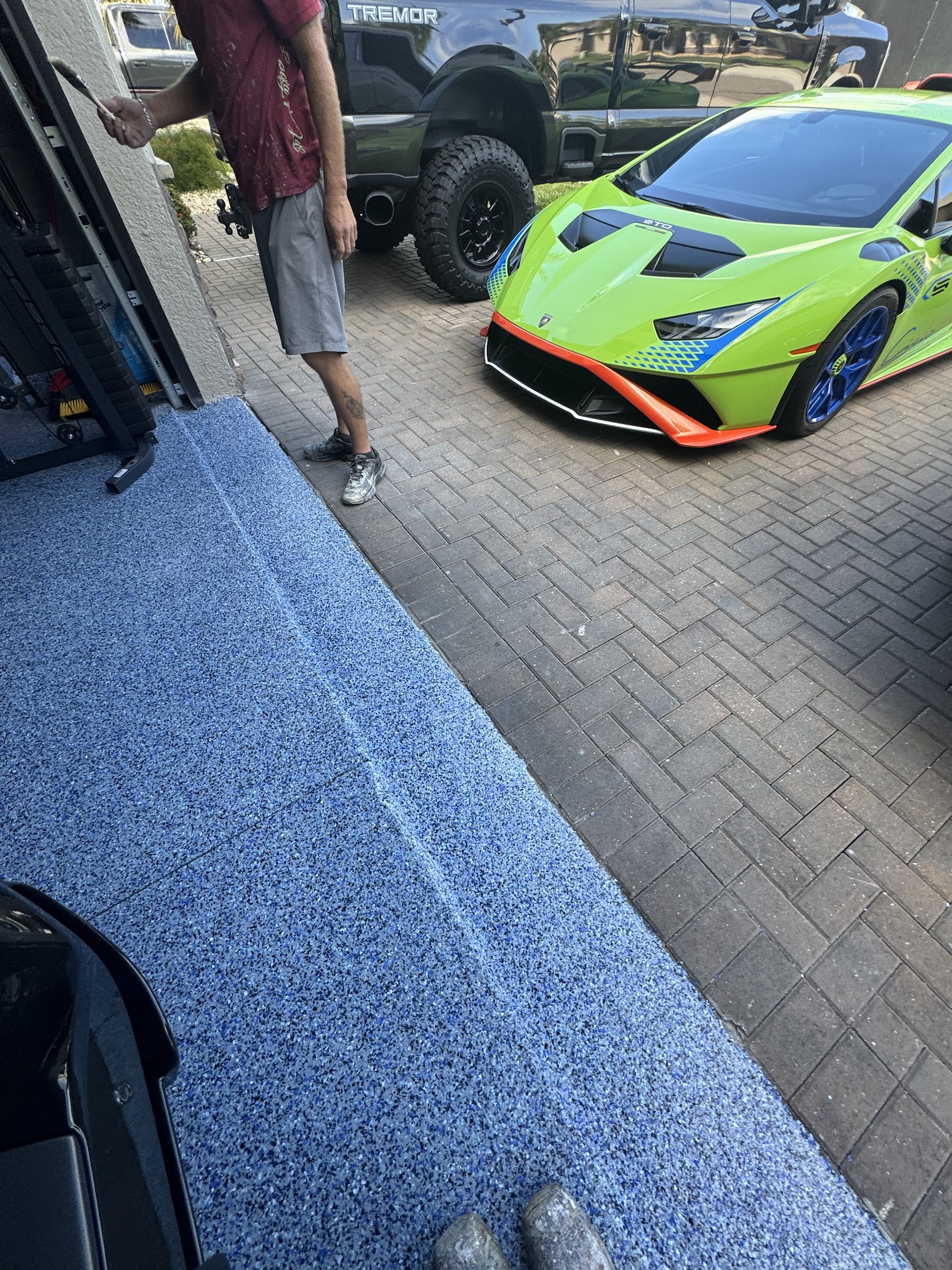 Blue flake epoxy garage floor coating in a Florida driveway